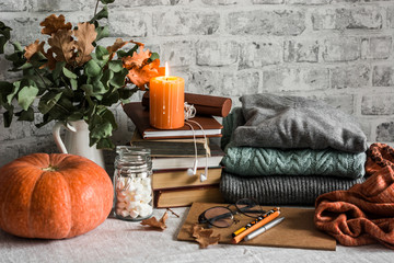 still life with pumpkins and autumn leaves