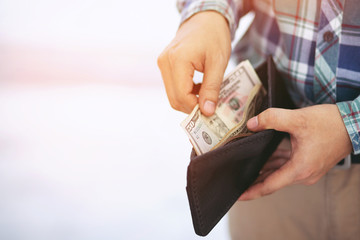 close up business man standing  hand hold Count the money spread of cash. concept finance Saving...