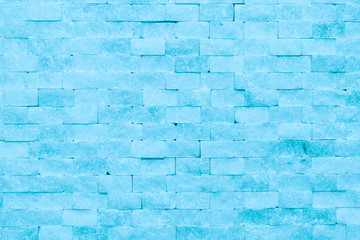 Wall of blue ice bricks and blocks background texture