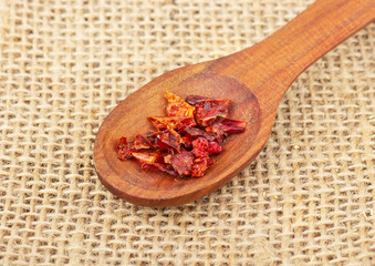 Dry red pepper in spoon