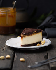 A classic creamy cheesecake with a chocolate base, roasted peanuts, salted caramel and chocolate - a favorite popular chocolate sweet