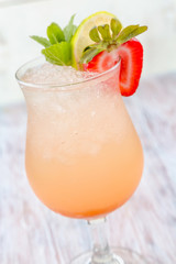 Fresh summer drink. Fresh lemonade. Lemonade on a light wooden background