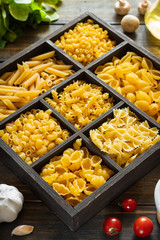 Different types of raw pasta. Italian food. Healthy food background concept.