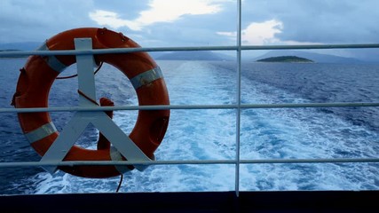 Life belt or life buoy on the ship floating the Mediterranean sea. Greece. 4K