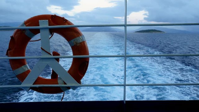 Life belt or life buoy on the ship floating the Mediterranean sea. Greece. 4K
