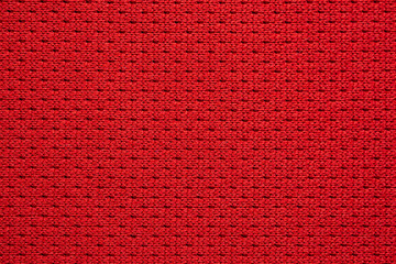 Red sports clothing fabric football jersey texture close up