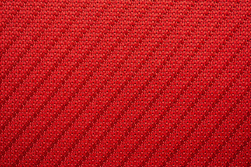 Red sports clothing fabric football jersey texture close up