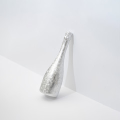 Minimal chamapgne bottle. New Year or Christmas party concept. Creative background.