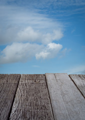 Empty old wood floor with blue sky  background.