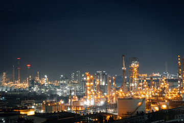 Fototapeta na wymiar Factory of power and energy industrial at night. Petrochemical plant at twilight.