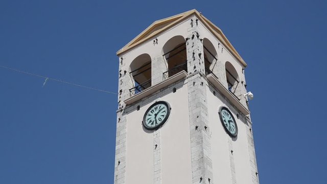 Clock tower in centre of Elbasan, Albania. Panorama over the city. Elbasan is The third largest city in Albania and popular tourist destination.