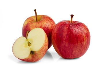 Red apple cut in slice half with water drop isolated on white background