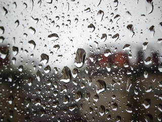 Water drop on window glass in rainy day