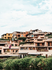 Fototapeta na wymiar Traditional houses in the luxury town of Porto Cervo in Sardinia, Italy
