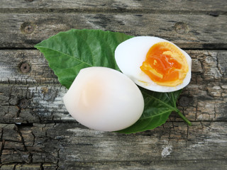 boil egg on leaf old wood table