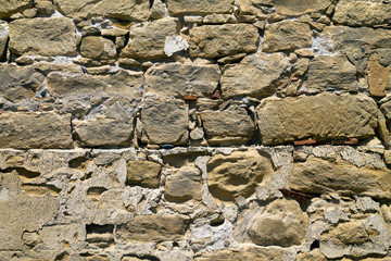 Old stone brick wall with cement 