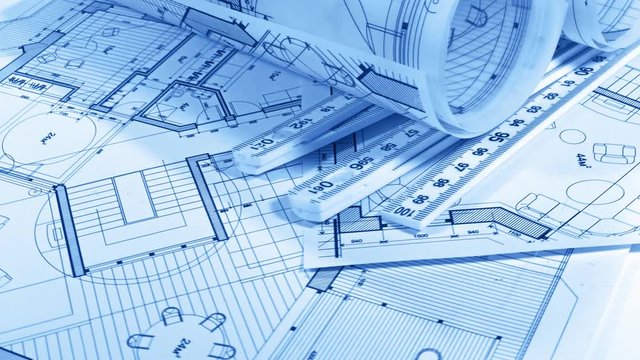 Blueprints - architectural drawings, yardstick - folding ruler smoothly rotate on the surface of the architectural plan of a modern house