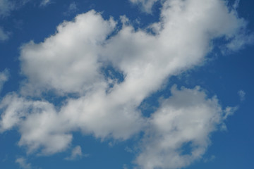 Cumulus clouds on a bright blue sky