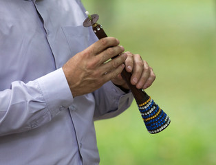 man playing on an asian horn - obrazy, fototapety, plakaty