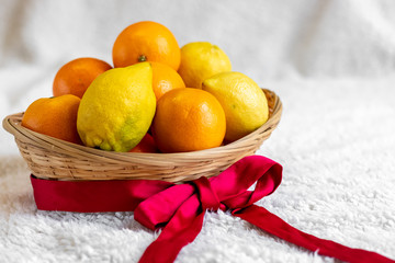 fresh oranges and lemons in a basket