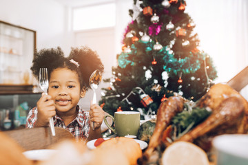 Little Girl Eating  and smile Thanksgiving Celebration Concept.Merry Christmas and Happy Holiday. Cute little child girl smile.