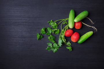 fresh vegetables on black wooden background