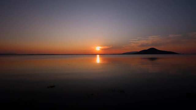 Sunset on the river. Nature river in sunset. Beautiful sunset in the nature in autumn. Autumn sunset in nature