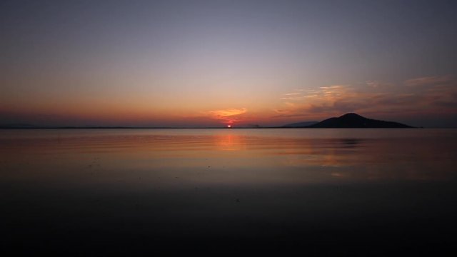 Sunset on the river. Nature river in sunset. Beautiful sunset in the nature in autumn. Autumn sunset in nature