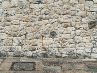 Medieval stone wall whith sidewalk