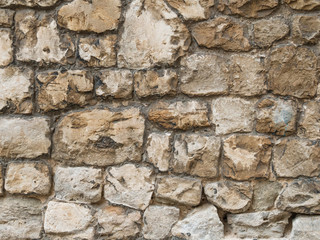 Natural rough stone wall - texture.
