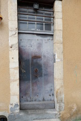 old wooden door in stone wall