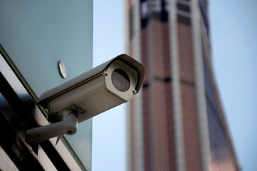 Security surveillance system at the entrance to a modern office building. Two cameras of video surveillance.