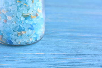 Amazing blue salt in crystal on blurred blue background. Mineral saline sodium chloride. Organic...