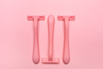 Three pink woman shaver different direction isolated on pink paper background. Copy space, place for text. Flat lay. Shaving concept.