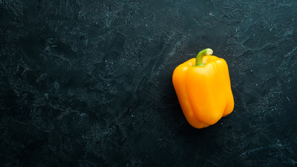 Sweet yellow bell pepper. Fresh vegetables. Top view. Free space for your text.