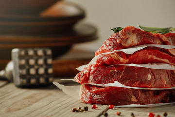 Chopped beefsteak on a kitchen table table in morning light. Rustic, place for text