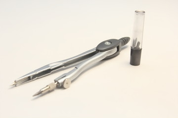  Compass with interchangeable in a box with stylus on a white background