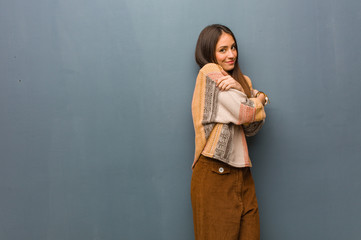 Fototapeta premium Young hippie woman giving a hug