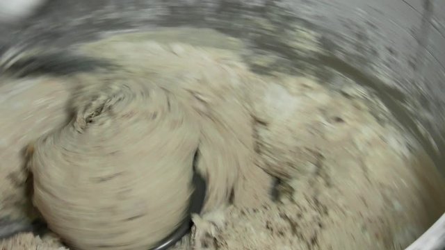 Machine dough kneading process for organic non-GMO bread without fillers and preservatives.