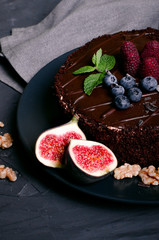 chocolate cake with fresh berries and nuts