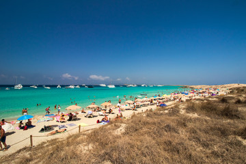Fototapeta na wymiar beach with umbrellas-des illetes from island formentera