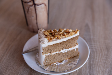 Almond Coffee Cake with vanilla latte on wood table 