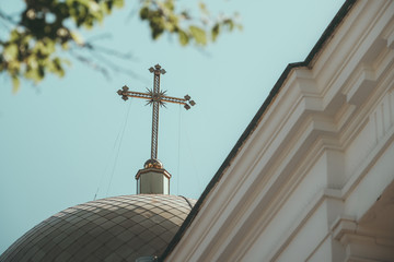 golden cross on the dome of the church