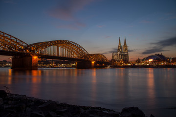Cologne Cityscape at night, showing the famous cathedral and the Hohenzollernbrücke