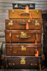 Stacked vintage leather suitcases