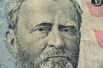 Fragment of a banknote of fifty american dollars.