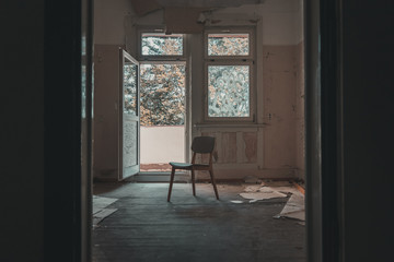 chair in a room in an abandoned building