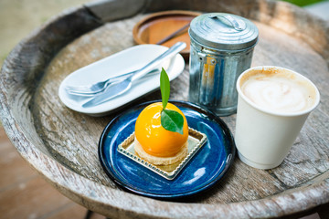 Orange Mousse Cake on Wood Table