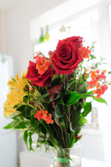 Red rose and a bouquet of flowers. Berries of red viburnum. A romantic gift from natural plants.