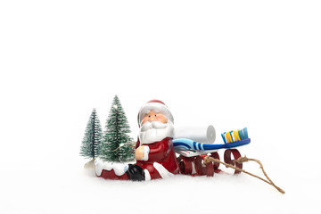 Dentist Dental Care Christmas New Year concept card with christmas tree Santa Claus sled toothbrush and toothpaste.